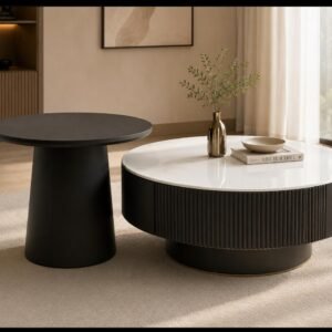 Round marble-top coffee table with fluted wood base and matching side table, styled in a modern living room