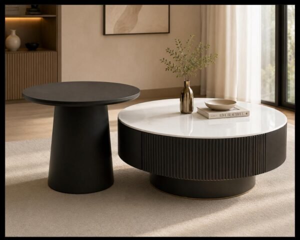 Round marble-top coffee table with fluted wood base and matching side table, styled in a modern living room