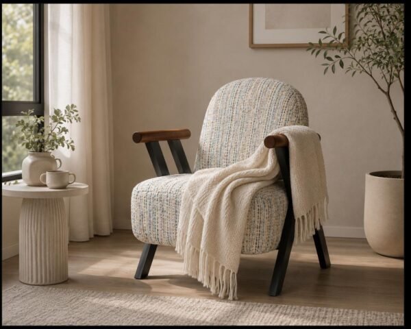 Woven lounge chair with wood arms and black steel frame in a modern living room corner