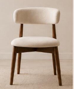 Modern dining chair with cream upholstery and walnut wood legs